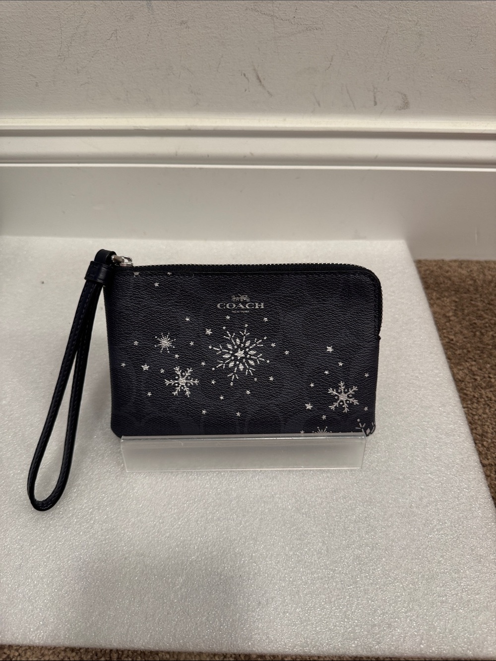 Coach snowflake print corner zip wristlet wallet
